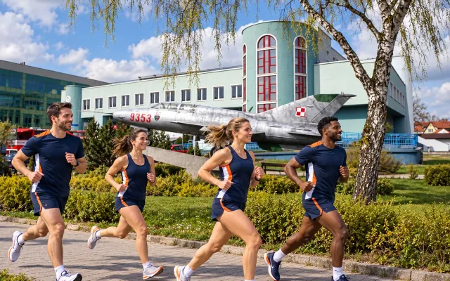 Running illustration for Goleniów: adult runners in a destination setting; not the featured race edition or its course.
