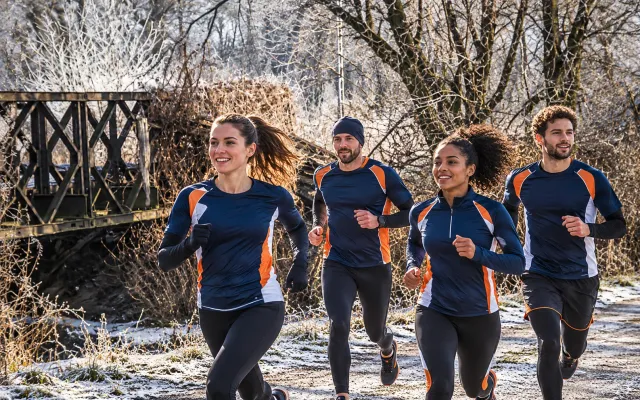 Running illustration for Kiełczów: adult runners in a destination setting; not the featured race edition or its course.