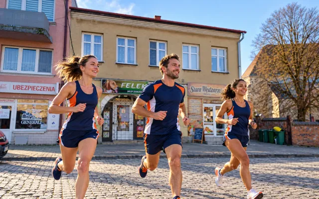 Running illustration for Strzyżów: adult runners in a destination setting; not the featured race edition or its course.